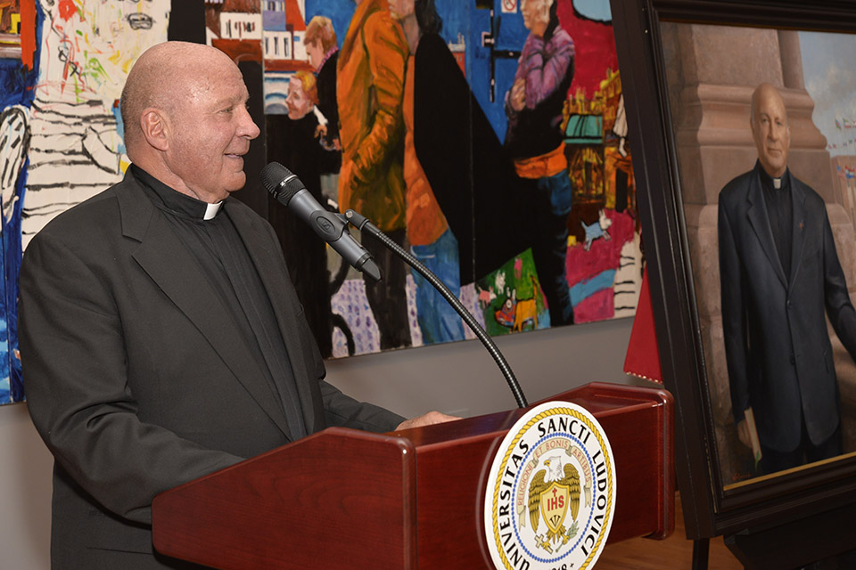 Father Biondi Portrait Unveiling Father Biondi standing at a lectern at his Portrait Unveiling