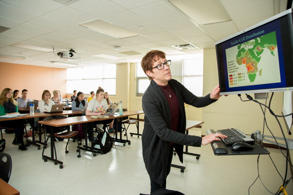 Katherine MAcKinnon, Ph.D. teaches an anthorpology class. Katherine MAcKinnon, Ph.D. teaches an anthorpology class.