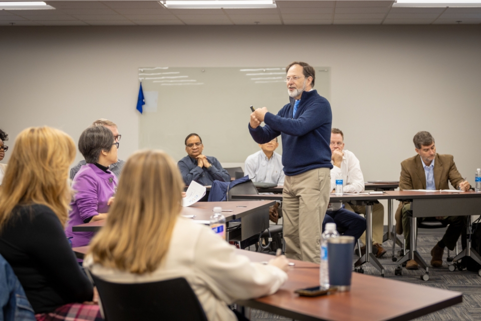 Formulating the Right Problem Workshop a man presenting in front of a group of people