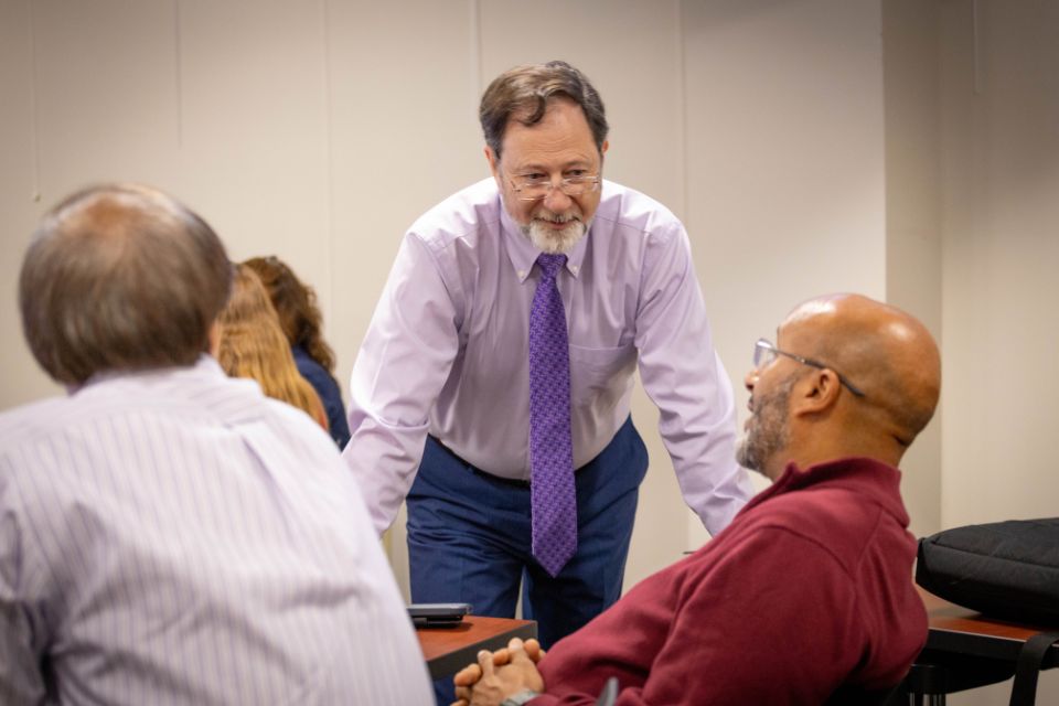 Leadership Development Workshop 2 A man standing and listening to participants