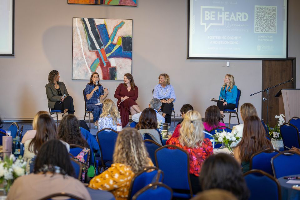 2025 Be Heard Leadership Conference A woman speaks to a crowd during the Women in Leadership Panel at the Be Heard Women in Leadership Conference.