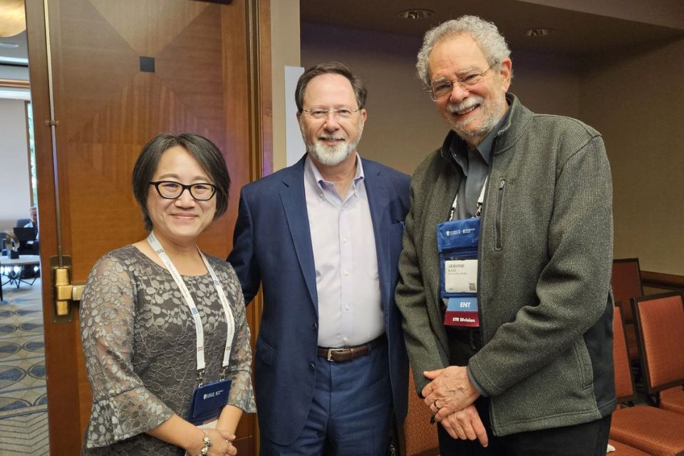 Jintong Tang, Jackson Nickerson, and Jerome Katz at AoM Three people stand together and smile.