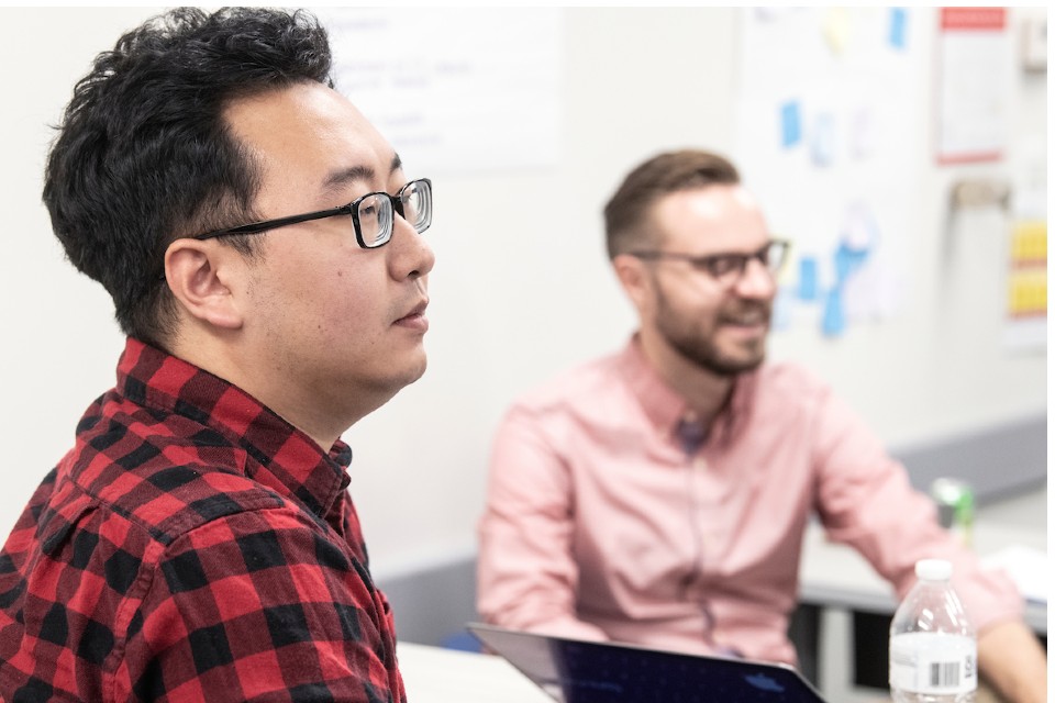Student and professor in background Student and professor in background