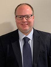 Justin Lacy Justin Lacy wearing suit and tie