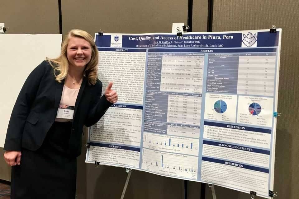 Julia Griffin ILEX project Julia Griffin standing in front of her ILEX project poster