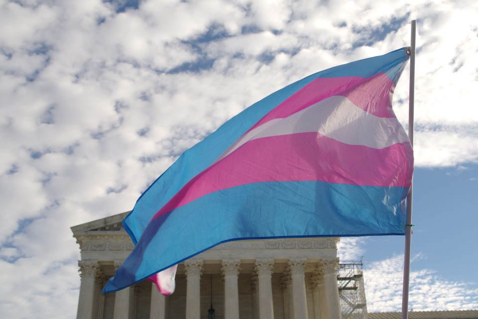 image of the Supreme Court of the United States with a transgender rights flag flying in the foreground image of the Supreme Court of the United States with a transgender rights flag flying in the foreground