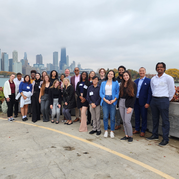 Spring 2023 Chicago Career Trek Students pose with the Chicago skyline in the background.