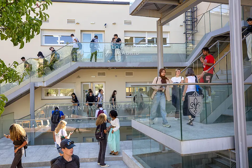 Spring 2024 study body represents 32 U.S. states and 69 nationalities. Students walk up and down stairs outdoors on the SLU Madrid campus.