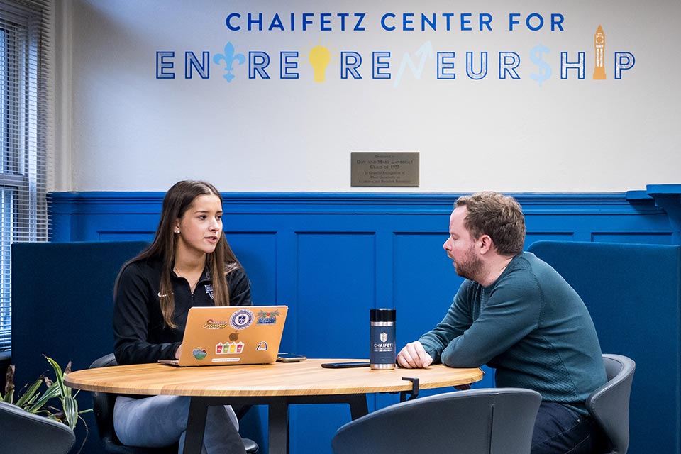 Entrepreneurship students with computer