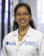 Headshot of Gabriela Espinoza, wearing white coat and smiling Headshot of Gabriela Espinoza