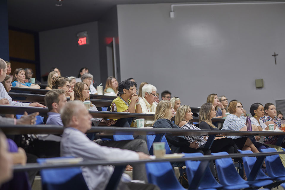 Grand Rounds Students and faculty members sit at seats in lecture auditorium.