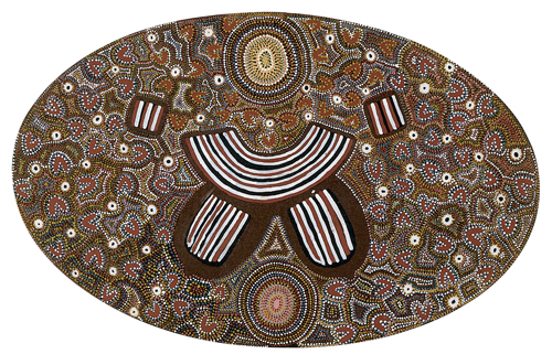 Joy Kngwarreye, Grass Seed, 1990. A painting by Joy Kngwarreye titled, Grass Seed. A stylized woman's torso with stripes is centered on a lozenge-shaped canvas. The background is extensively patterned in colorful dots.