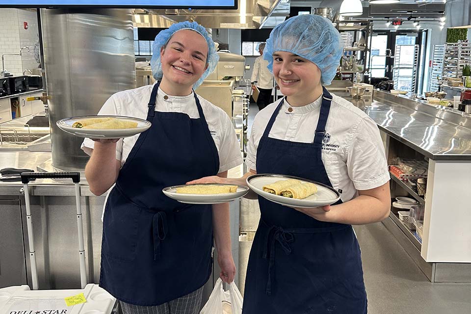 Senior students Hannah Bast and Anna Durfey clinched third place and a $1,000 prize for their innovative crepes filled with pesto chicken and roasted tomatoes. Submitted photo.