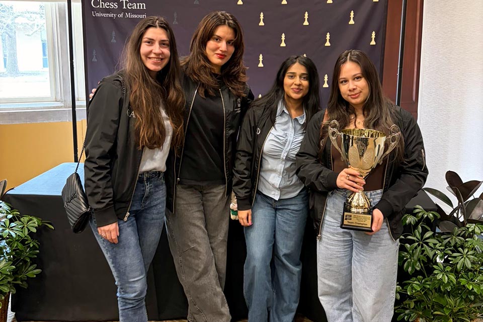 a group of women posing for a photo