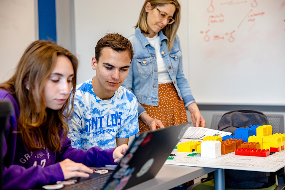 SLU students and an advisor work on the UrbanPlan.