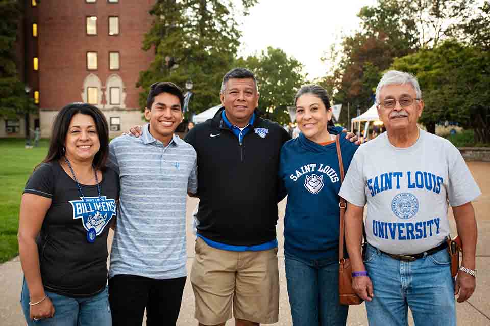 SLU gear at The Billiken Shop Family gathered outside dressed in SLU gear