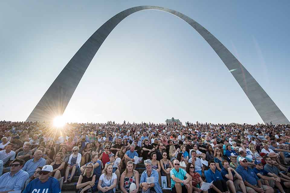 2018 Bicentennial Mass Mass attendees sit on the stairs in front of the Arch during SLU's celebratory Bicentennial Mass.
